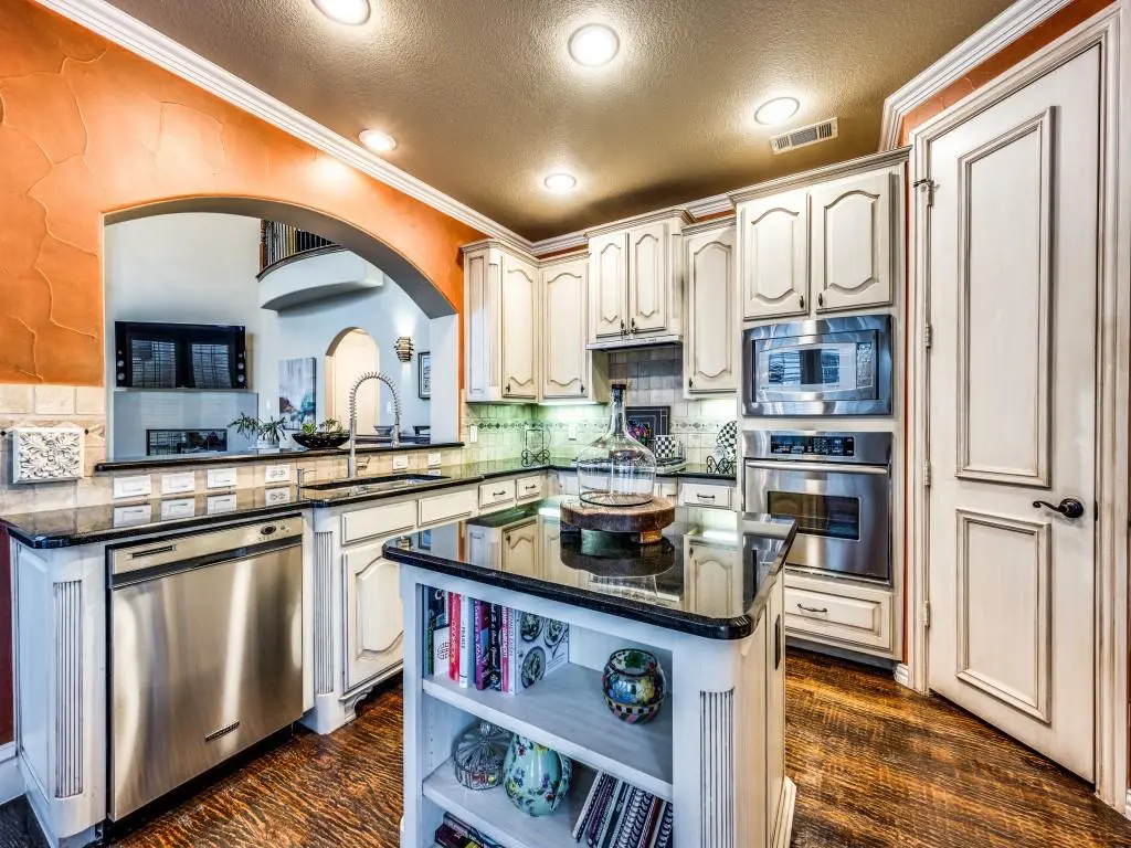 Kitchen with white cabinetry and granite countertops